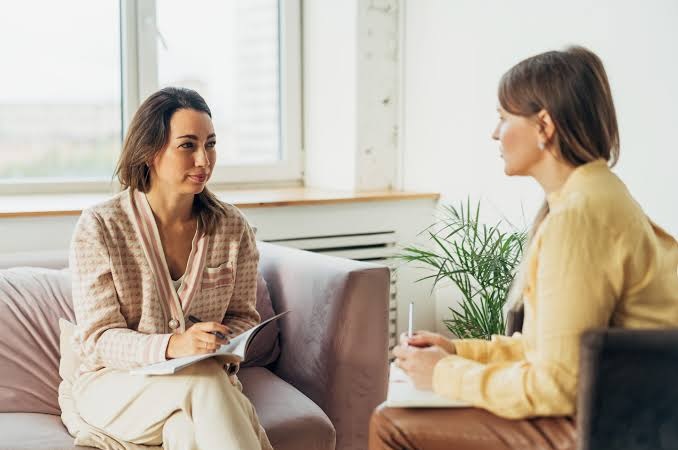A therapist listens to a patient during an individual counseling session in an intensive outpatient program.
